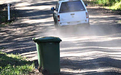 This car could just fit between these rubbish bins along McIntosh Creek Road. This car could just fit between these rubbish bins along McIntosh Creek Road.